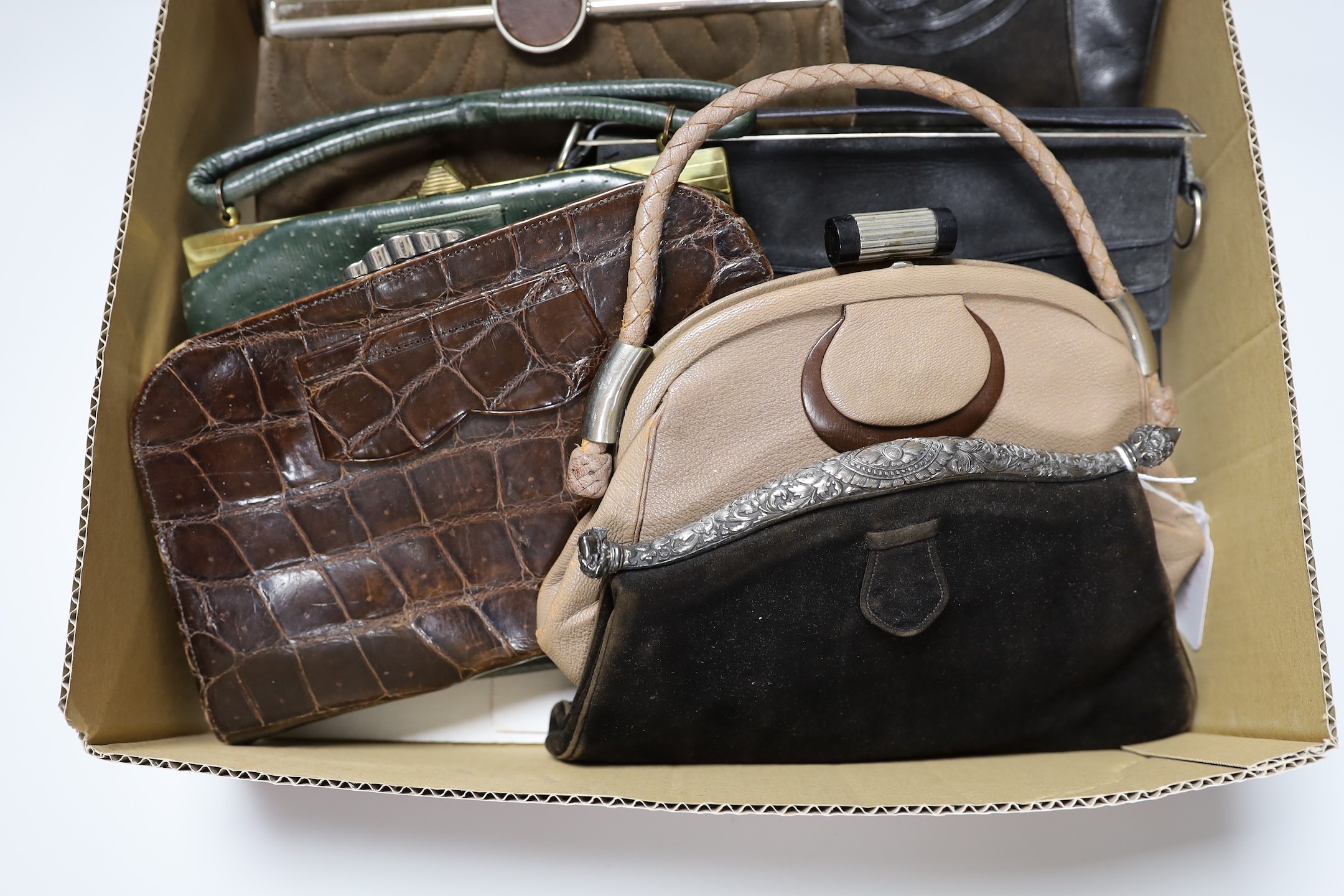 A collection of nine 1930's and 1940's leather, suede and crocodile ladies handbags with unusual metal clasps and frames